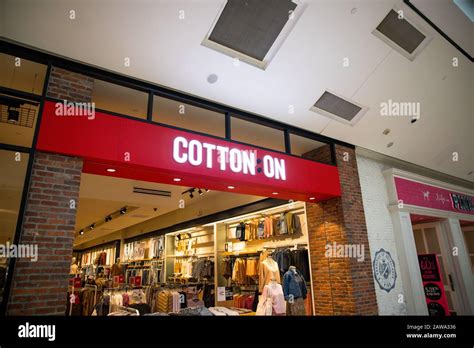 Cotton on clothe shop front store sign Stock Photo - Alamy