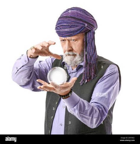 Male fortune teller with crystal ball on white background Stock Photo ...