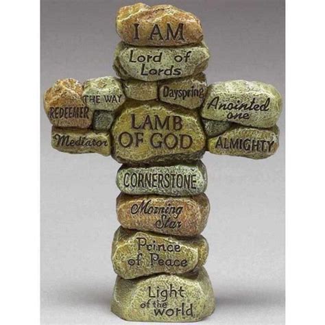 a cross made out of rocks with the words i am lord of lamb of god