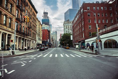 New York City street road in Manhattan at summer time. Urban big city life concept background ...