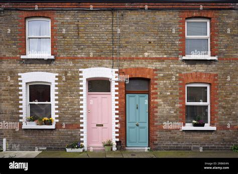 Small old mews houses with colorful brick patterns Stock Photo - Alamy