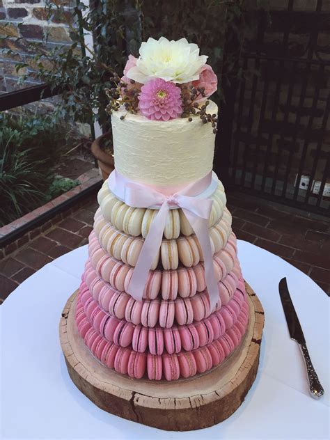 6 tier ombré pink macaron tower with a white chocolate mudcake with rustic white chocolate ...