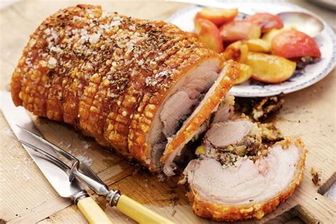 Prune and couscous stuffed roast pork with baby apples