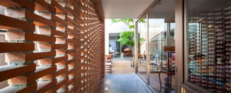 Perforated Brick Facades Make a Home More Stylish and Energy Efficient