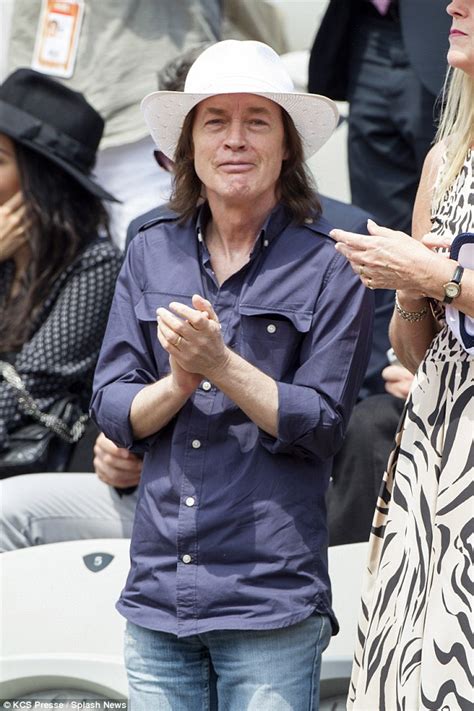 Angus Young, 60, looks frail as he watches the French Open | Daily Mail Online