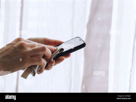 Cleaning the smartphone screen with a fiber cloth Stock Photo - Alamy