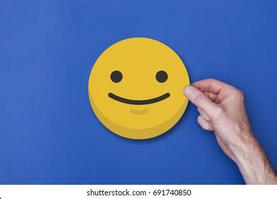 Male Hand Holding Emoji Emoticon Smiley Stock Photo 691740850 | Shutterstock