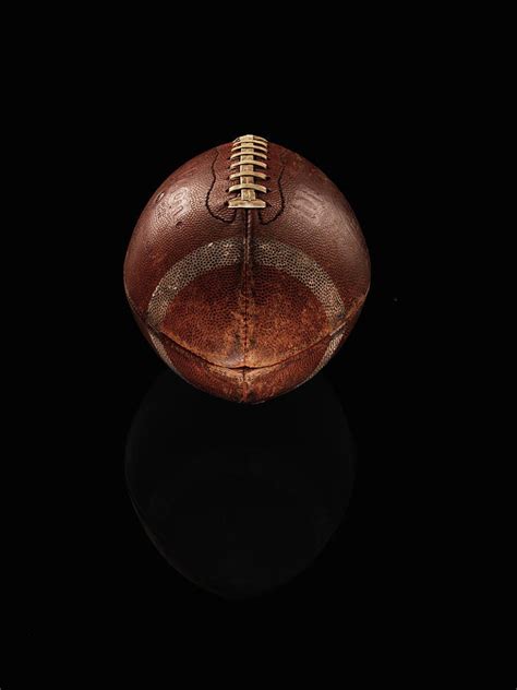 Old Football On Black Background By Alexander Nicholson ...