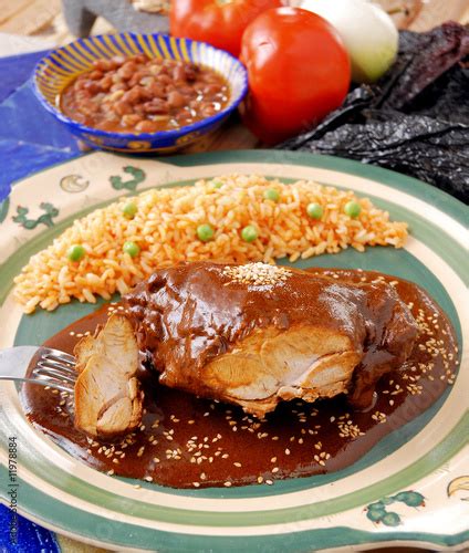 Mole con pollo y arroz rojo. México Stock Photo | Adobe Stock