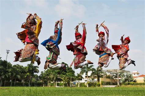 Performers dressed in traditional attire rehearse for Garba, a folk dance, ahead of Navratri, a ...