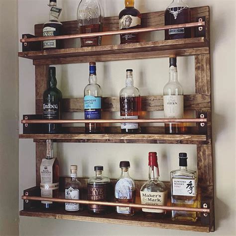 A new client asked for a liquor bottle display with a rustic feel, but made from higher quality ...