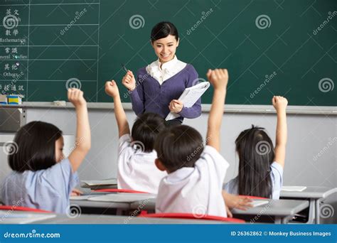 Teacher With Students In Chinese School Classroom Stock Photography ...