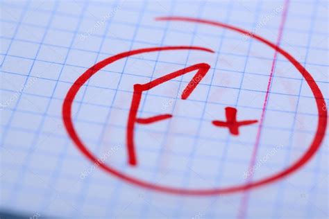 Grade F written on an exam paper — Stock Photo © belchonock #37358455