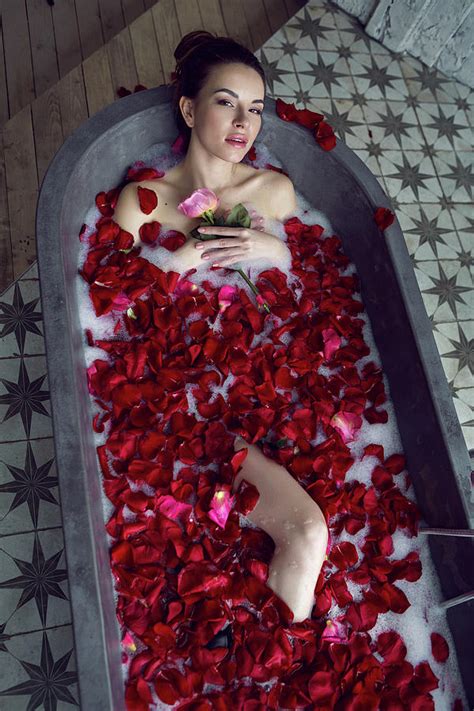 Beautiful Girl Lying In A Stone Bath With Rose Petals And Foam Photograph by Elena Saulich ...