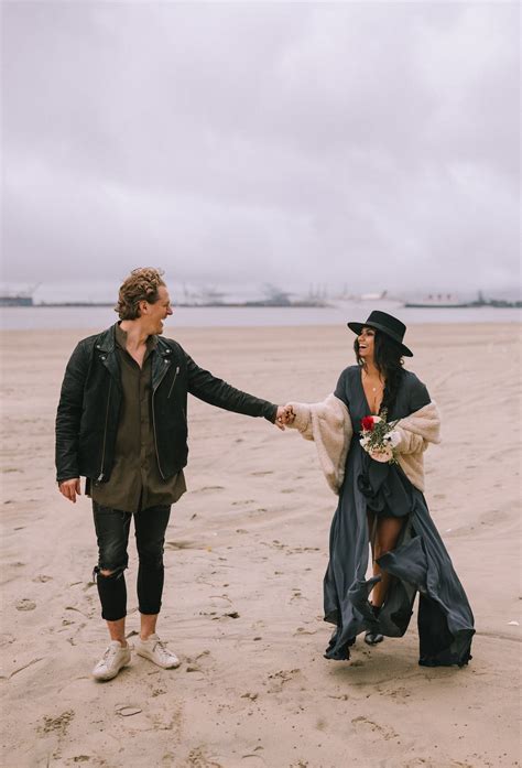 A Couple Doing Holding Hands at the Beach · Free Stock Photo