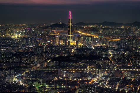 Seoulful night - Illuminated night cityscape over Seoul city, the capital of South Korea. Taken ...