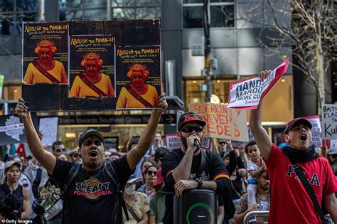 Protesters in Australia torch national flag as they demand Monarchy is abolished | Daily Mail Online