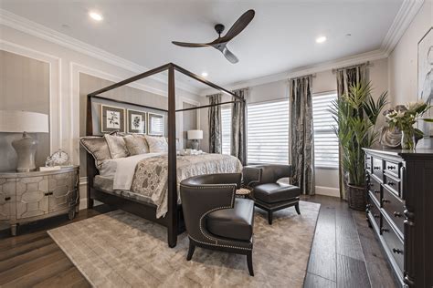 Elegant ambiance in this shades of grey masters bedroom.