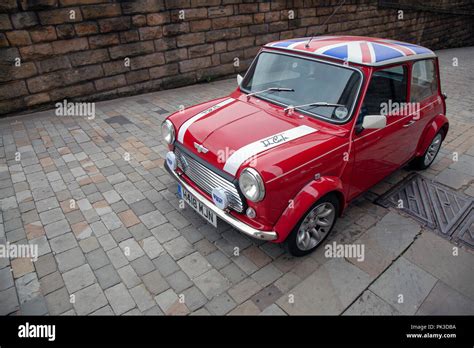 A Red Mini Cooper wth a Union Jack Roof by John Cooper version of the ...