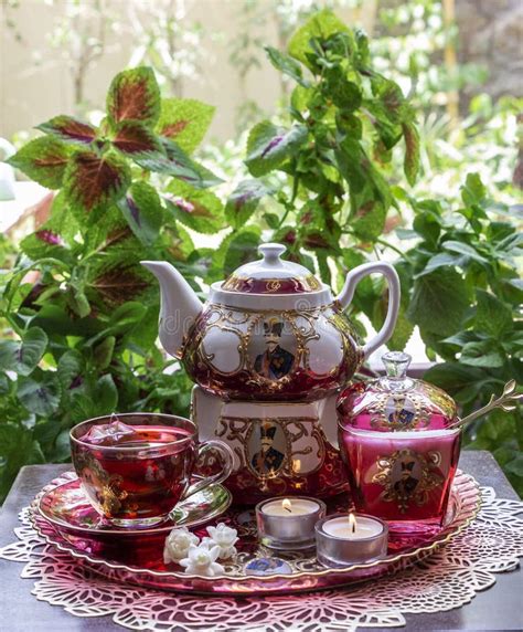 Beautiful Persian Tea Set and Lit Candles on the Table with Green ...