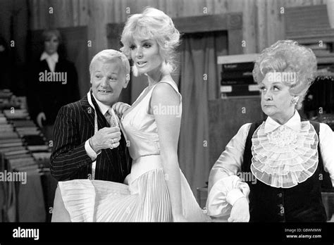 Actress Candy Davis gets the "Are You Being Served" treatment from John Inman and Mollie Sugden ...