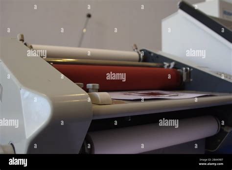 Plastic laminating machine Stock Photo - Alamy