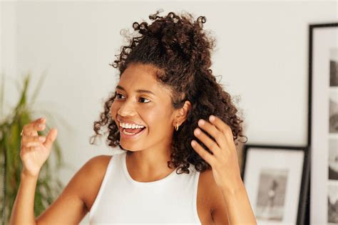 "Laughing Woman Portrait At Home" by Stocksy Contributor "Ohlamour Studio" - Stocksy