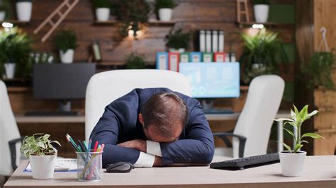 Businessman Sleeping With Head On Desk Is Stock Footage SBV-335603128 ...