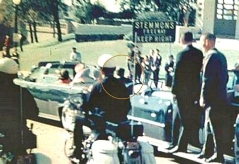 Look at JFK circled he is looking towards the umbrella man. To hide in the open is the safest ...