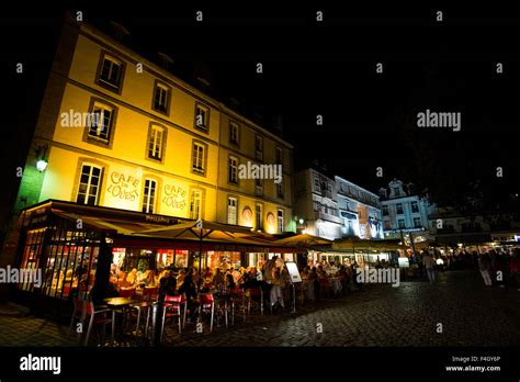 Restaurants and cafes at night in the historic walled city of St Malo, France Stock Photo - Alamy