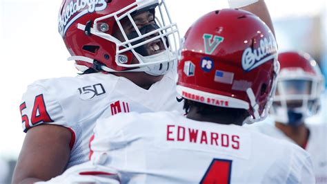 Why does Fresno State football have a 'V' on the back of its helmets?