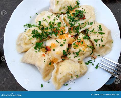 Traditional Polish Cheese and Potato Dumplings with Parsley and Grilled Onion Stock Photo ...