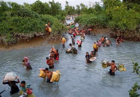 Rohingya refugees crossing Naf river at the Bangladesh-Myanmar border ...