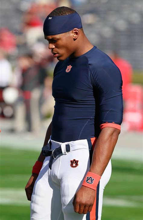 Quarterback Cameron Newton #2 of the Auburn Tigers listens during a ...