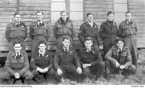 Group portrait of Flight Sergeants of 467 Squadron at an RAF base in the United Kingdom. In the ...