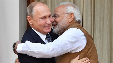 Putin and Modi exchange hugs as India signs Russia missile deal despite sanctions threat | World ...