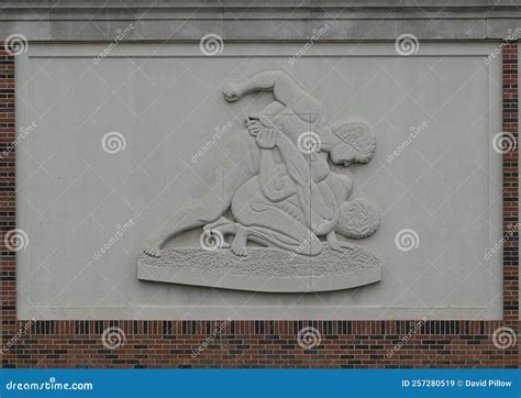 Relief with Two Men Wrestling on the Exterior of the National Wrestling Hall of Fame and Museum ...