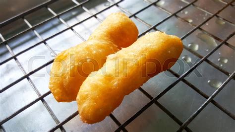 Close-up deep-fried dough stick, ... | Stock image | Colourbox