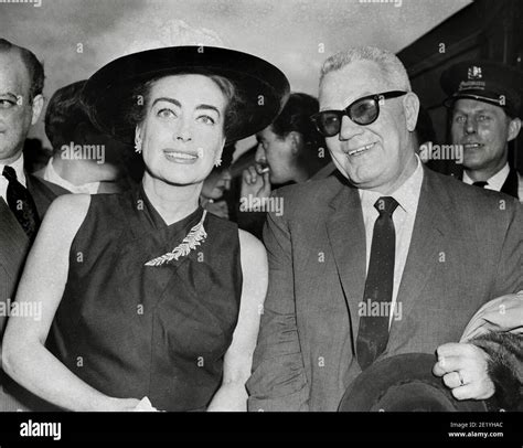 Joan Crawford and her husband, (President of Pepsi Cola) Alfred Steele, on their arrival at ...