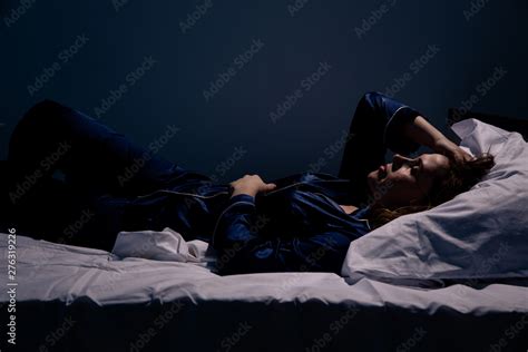 Sad alone woman lying the bed. Insomnia concept Stock Photo | Adobe Stock