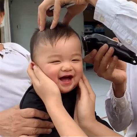 A bundle of laughs! Cute baby erupts into fits of giggles as he gets his first haircut | Daily ...