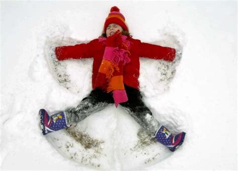 Pictures of Kids Making Snow Angels During Winter Storm