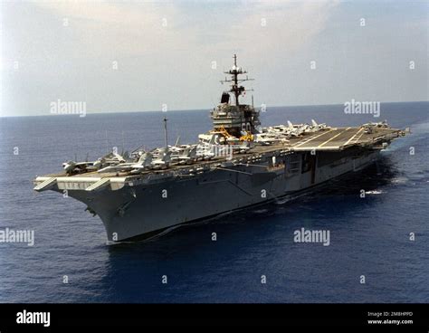 A port bow view of the aircraft carrier USS SARATOGA (CV-60) underway. Base: USS Saratoga (CV 60 ...