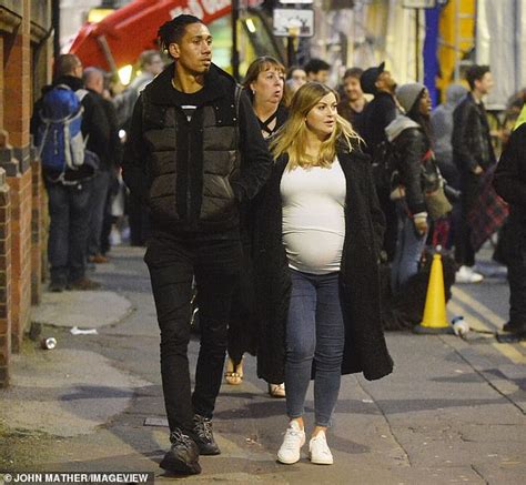 Chris Smalling takes a stroll around Manchester with wife Samantha ...