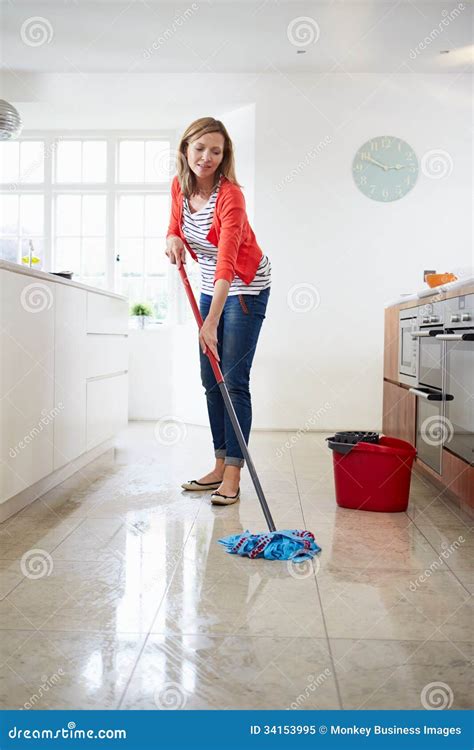 Woman Mopping Kitchen Floor Stock Image - Image: 34153995