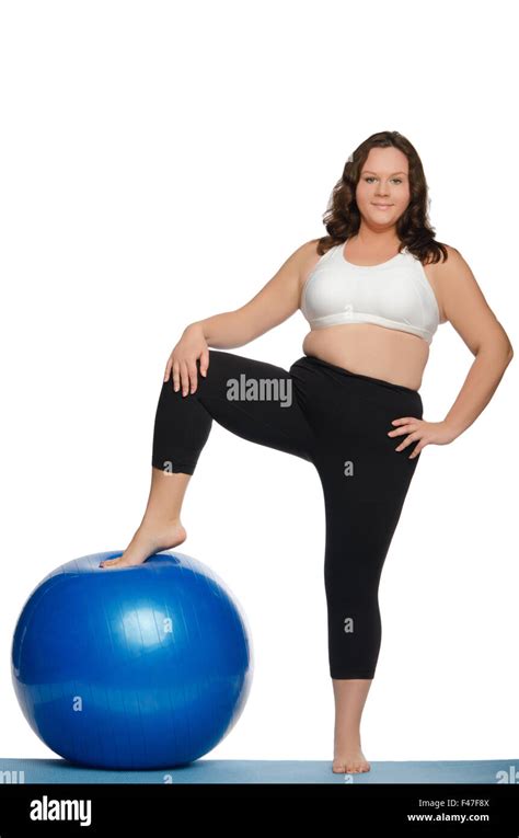 stout woman with blue ball fitness Stock Photo - Alamy