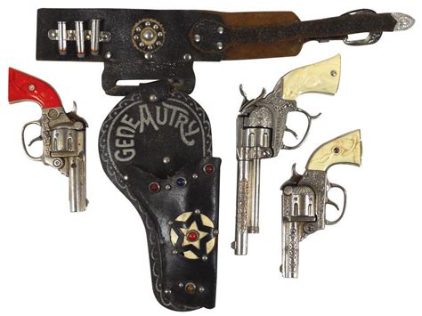 Gene Autry cap guns & holster, 2 small cap guns, 6.5"L, large cap gun, 9"L & single holster, c.1930'