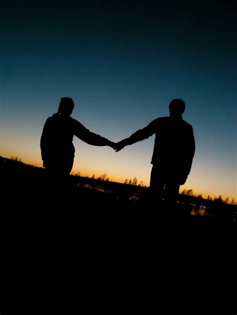 Two People Holding Hands Silhouette