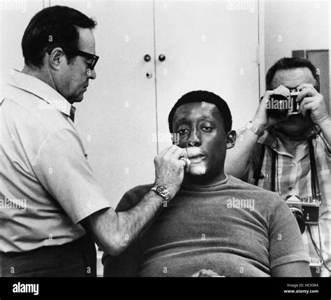 WATERMELON MAN, Godfrey Cambridge, being made-up on-set, 1970 Stock ...