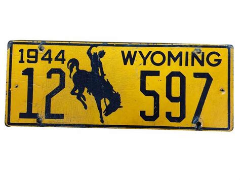 Neat 1944 Wyoming license plate with cowboy/bucking bronco lo